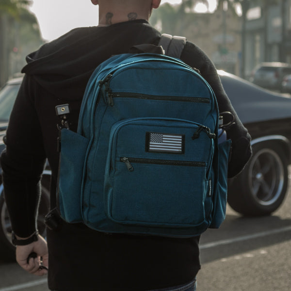 A real Maxpedition user carries his Prepared Citizen Deluxe - an Everyday Carry product - as he walks towards his car.