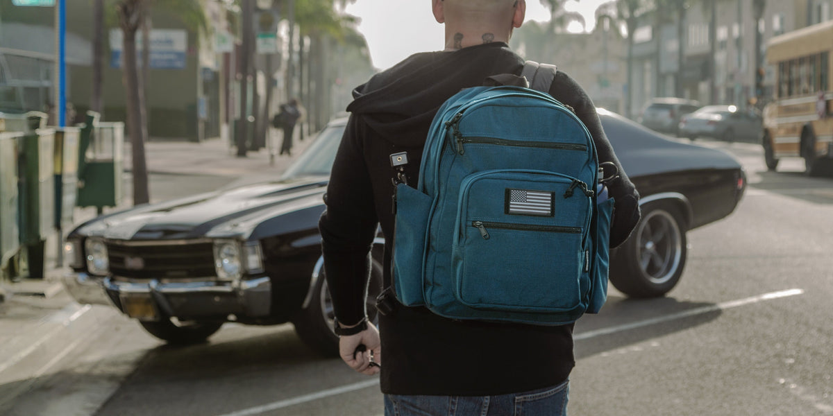 A real Maxpedition user carries his Prepared Citizen Deluxe - an Everyday Carry product - as he walks towards his car.